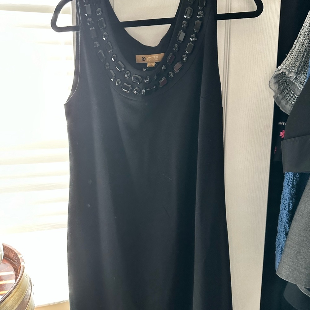 Black cocktail dress with rhinestone collar.